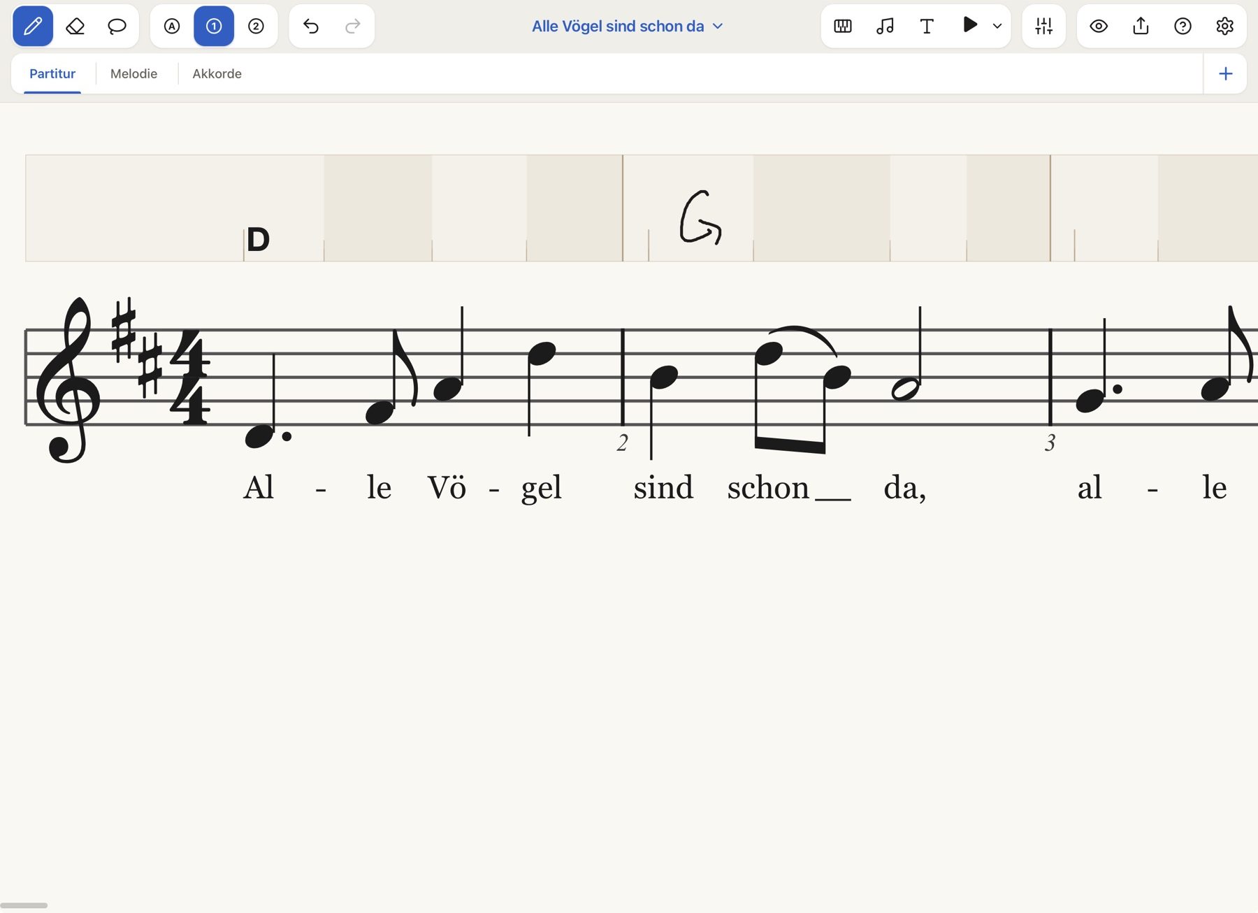 Ausschnitt von „Alle Vögel sind schon da“ in der Nahansicht: Über der Melodie steht die Akkordspur mit einem gesetzten D und einem handgeschriebenen G, darunter der Liedtext.